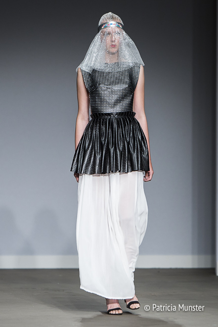 Black 'armour' with white skirt by Maaike van den Abbeele at Fashionweek Amsterdam